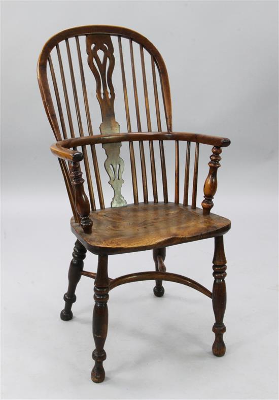 A 19th century elm, ash and yew wood comb back Windsor chair, H.3ft 6in.